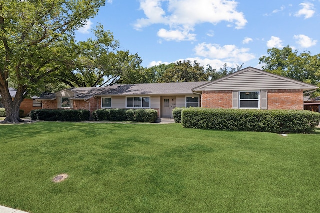 ranch-style house with a front lawn