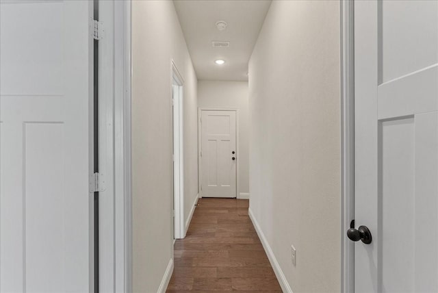 corridor featuring hardwood / wood-style floors