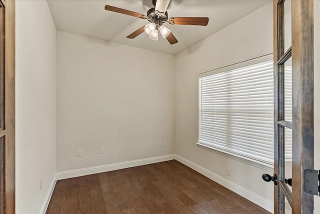 spare room featuring ceiling fan and dark hardwood / wood-style floors