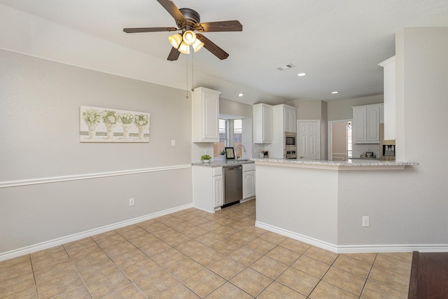 kitchen with white cabinets, light tile patterned floors, stainless steel appliances, and sink