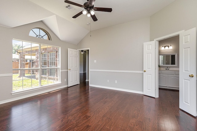 unfurnished room featuring dark hardwood / wood-style flooring, ceiling fan, lofted ceiling, and sink