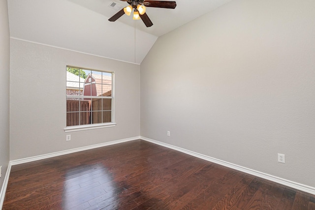 empty room featuring ceiling fan, dark hardwood / wood-style flooring, and lofted ceiling