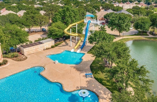 view of swimming pool featuring a water view and a water slide