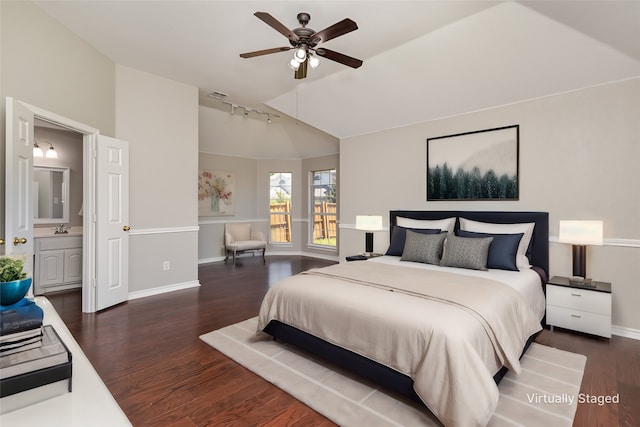 bedroom with ensuite bathroom, dark hardwood / wood-style flooring, ceiling fan, and track lighting