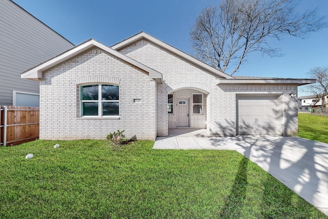 view of front of property with a garage and a front lawn