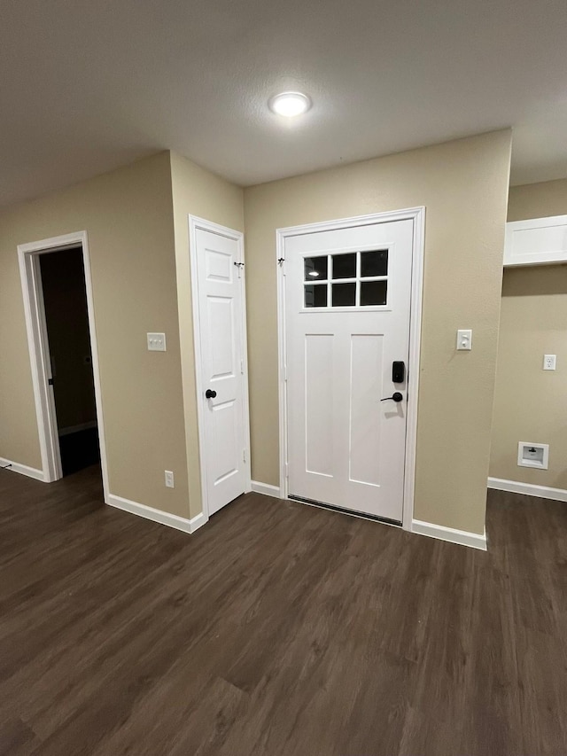 foyer entrance featuring dark hardwood / wood-style floors