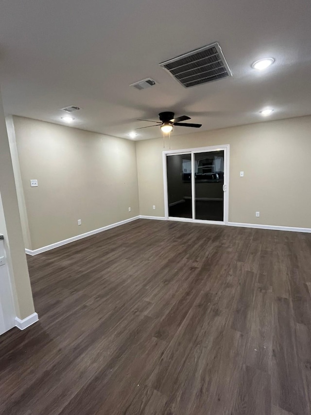 unfurnished room with ceiling fan and dark hardwood / wood-style floors