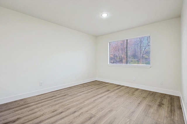 unfurnished room featuring light hardwood / wood-style floors