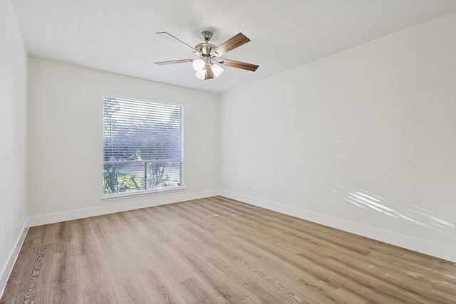 spare room featuring ceiling fan and light wood-type flooring