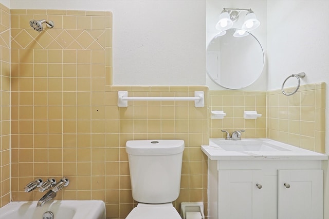 full bathroom featuring shower / bathing tub combination, vanity, toilet, and tile walls