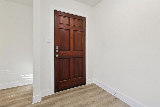 foyer with light wood-type flooring