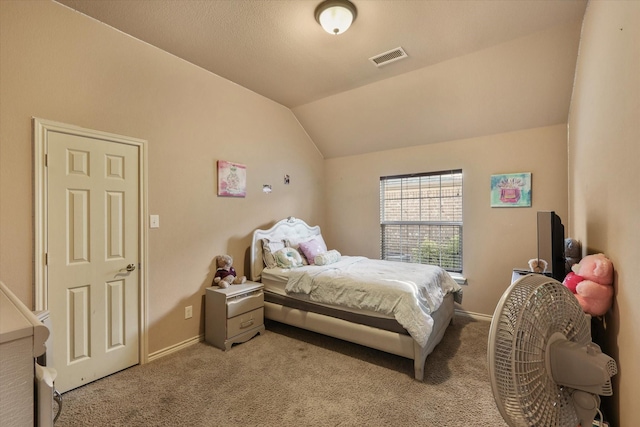 bedroom featuring vaulted ceiling and light carpet