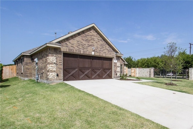 view of home's exterior featuring a garage and a yard