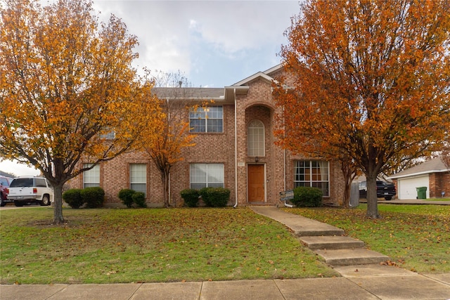 view of front of home featuring a front lawn