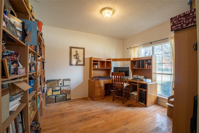 office space with hardwood / wood-style floors and a textured ceiling