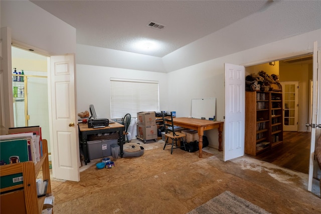 office area with a textured ceiling