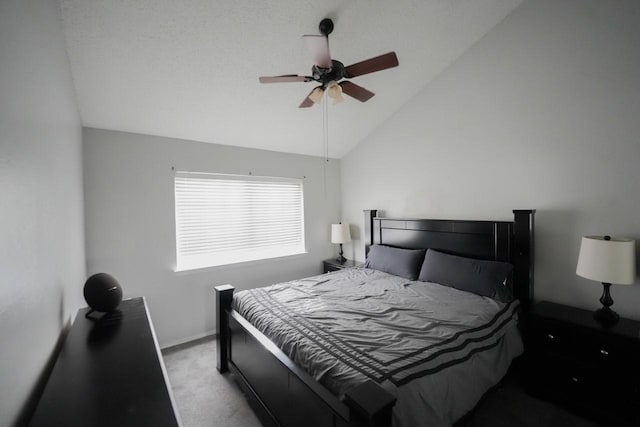 bedroom with ceiling fan, lofted ceiling, and light carpet