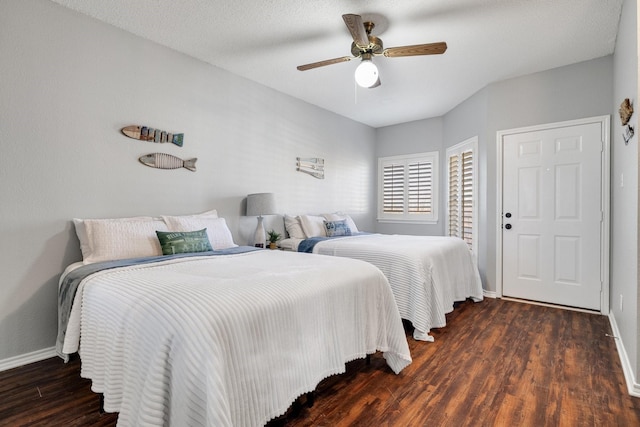 bedroom featuring ceiling fan and dark wood-type flooring