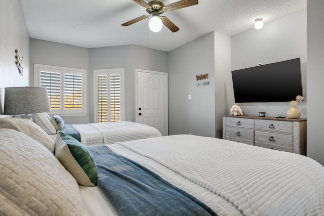 bedroom featuring a textured ceiling and ceiling fan