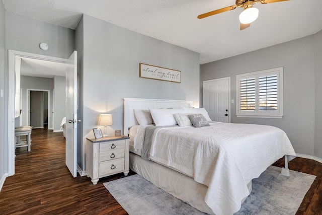 bedroom with ceiling fan and dark hardwood / wood-style floors