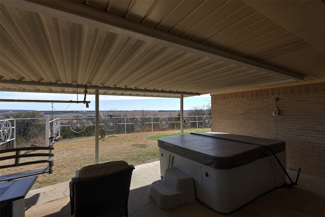 view of patio with a hot tub