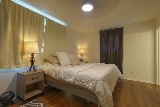 bedroom featuring dark wood-type flooring and ceiling fan