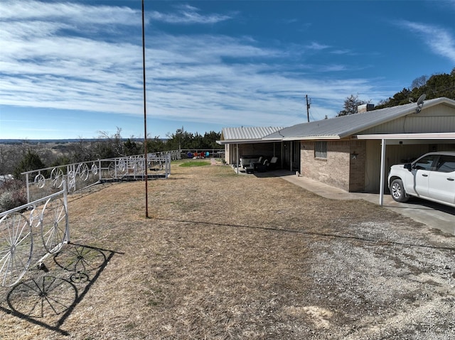 view of yard featuring a carport