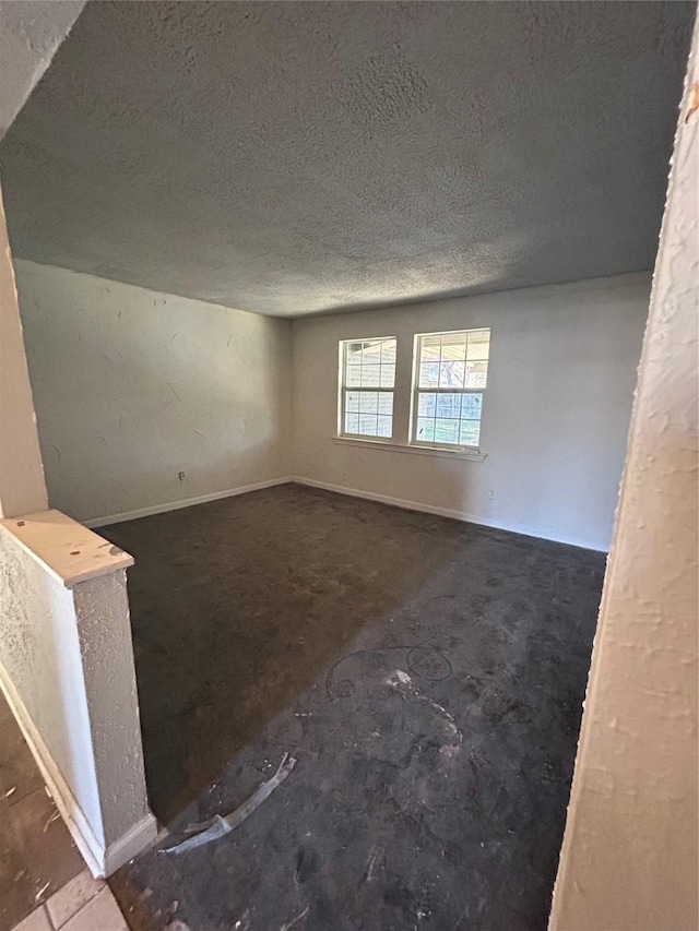 empty room featuring a textured ceiling