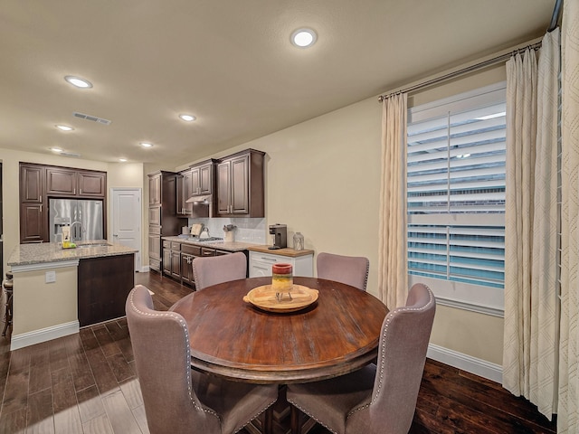 dining space with sink