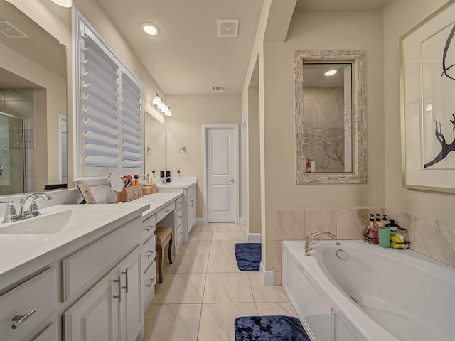 bathroom with vanity, tile patterned floors, and separate shower and tub