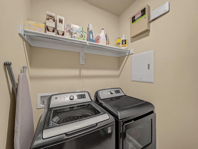 washroom with washer and dryer