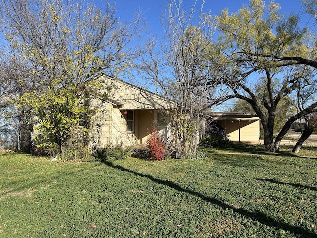 view of home's exterior featuring a lawn