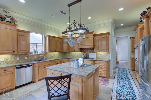 kitchen with pendant lighting, stainless steel appliances, a center island, and light stone countertops