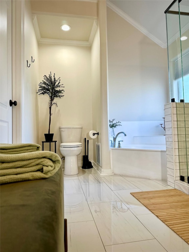 bathroom featuring a washtub, ornamental molding, and toilet