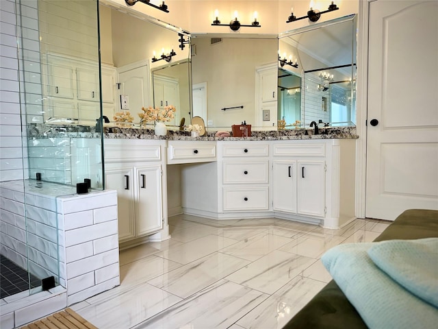 bathroom with vanity and an enclosed shower