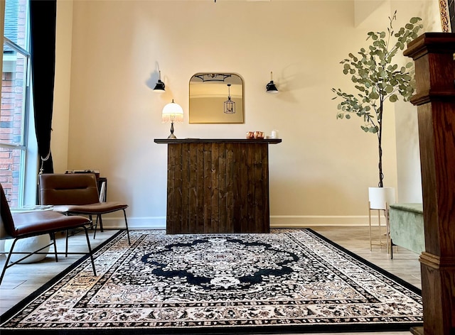 sitting room with hardwood / wood-style floors