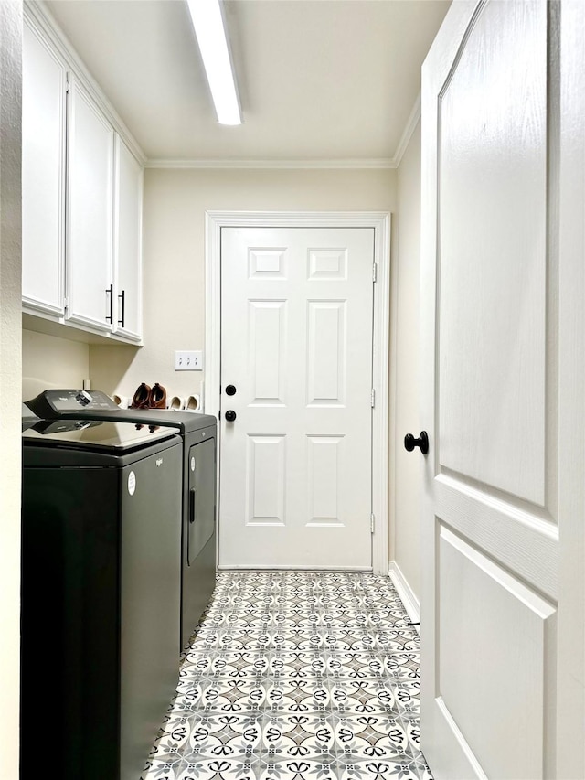 washroom with crown molding, cabinets, and independent washer and dryer