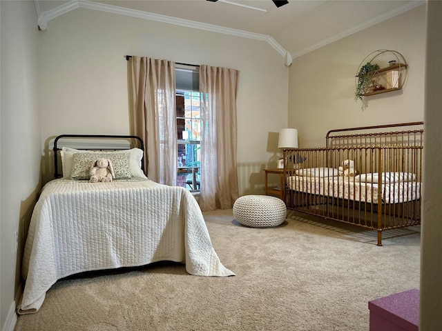 carpeted bedroom with crown molding, ceiling fan, and lofted ceiling