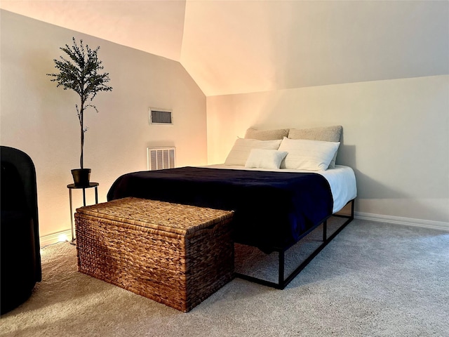 bedroom with carpet flooring and vaulted ceiling