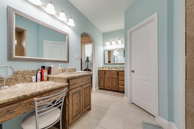 bathroom with vanity and tile patterned floors