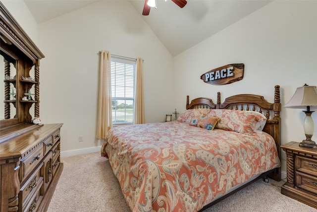 carpeted bedroom featuring high vaulted ceiling and ceiling fan