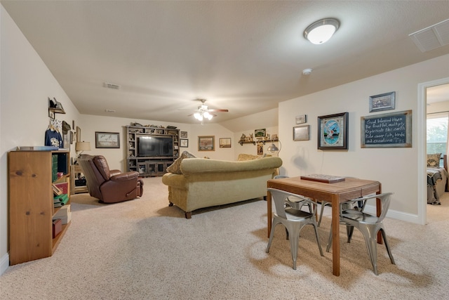 carpeted living room featuring ceiling fan