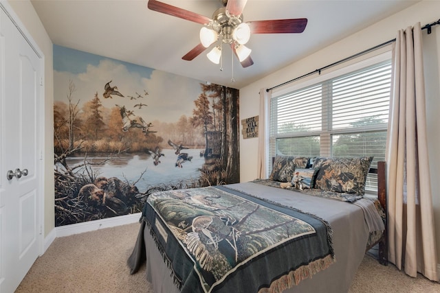 bedroom featuring ceiling fan and light carpet