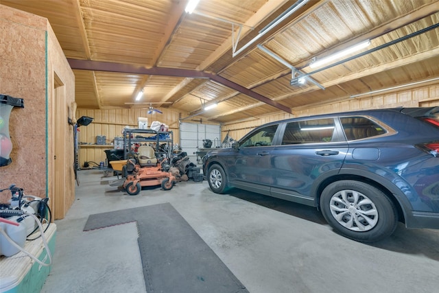 garage with a garage door opener and a carport