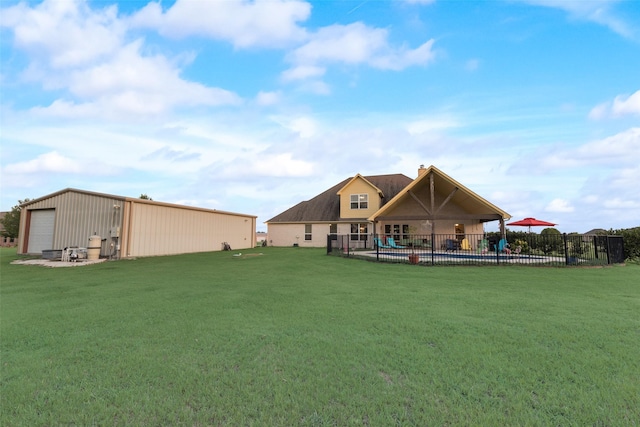 view of yard with an outbuilding and a swimming pool