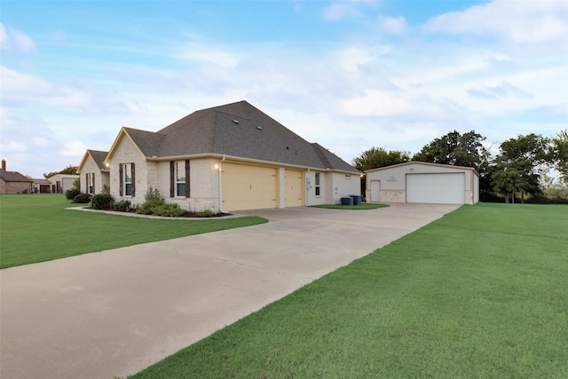 view of front of home with a front yard and a garage