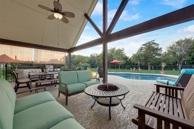 view of patio / terrace with a fenced in pool, an outdoor living space with a fire pit, and ceiling fan