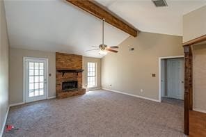 unfurnished living room featuring ceiling fan, carpet flooring, a fireplace, and lofted ceiling with beams