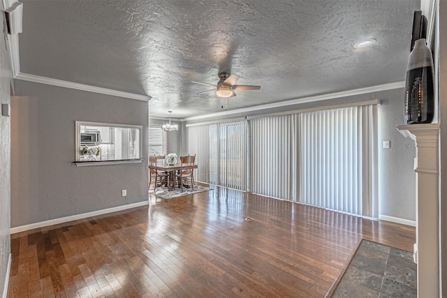 unfurnished living room with hardwood / wood-style floors, ceiling fan with notable chandelier, crown molding, and a textured ceiling