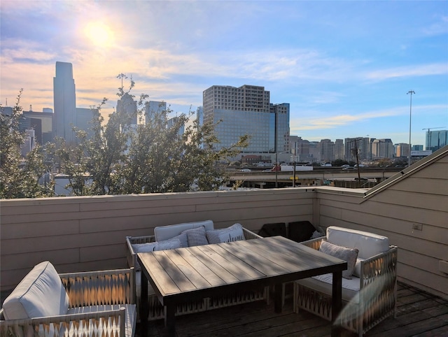 wooden deck featuring a city view